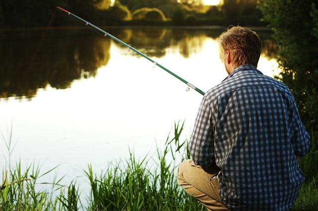 Patience: Man fishing in the river.