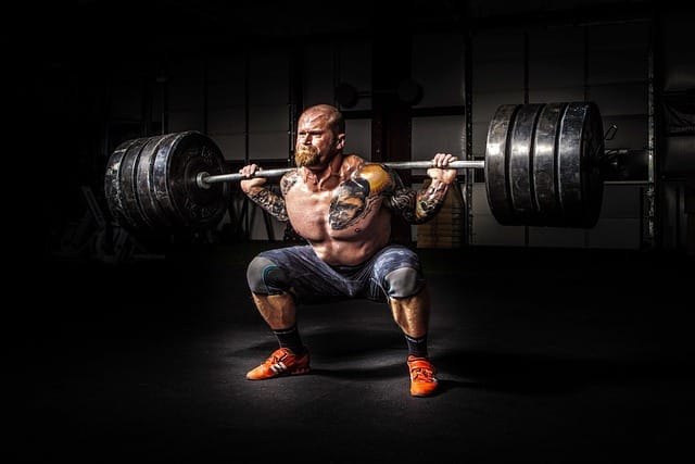 Power: Man doing Squats with large weights.