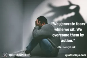 A person sitting in a dark room, looking anxious or fearful