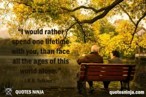 Couple sitting on bench lakeside