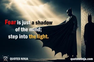 Batman stand atop of the building against the wall